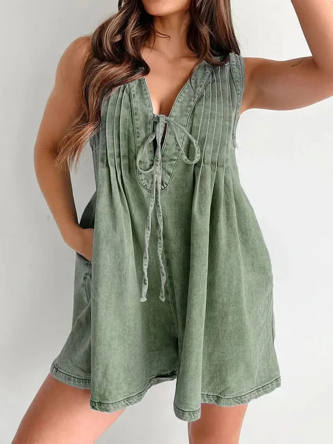 Sage green denim romper front view with V-neck and drawstring details