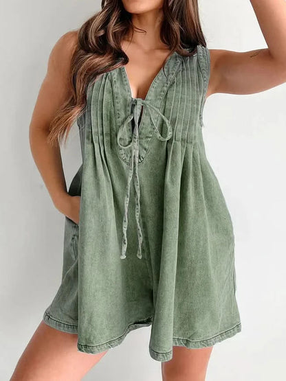 Sage green denim romper front view with V-neck and drawstring details
