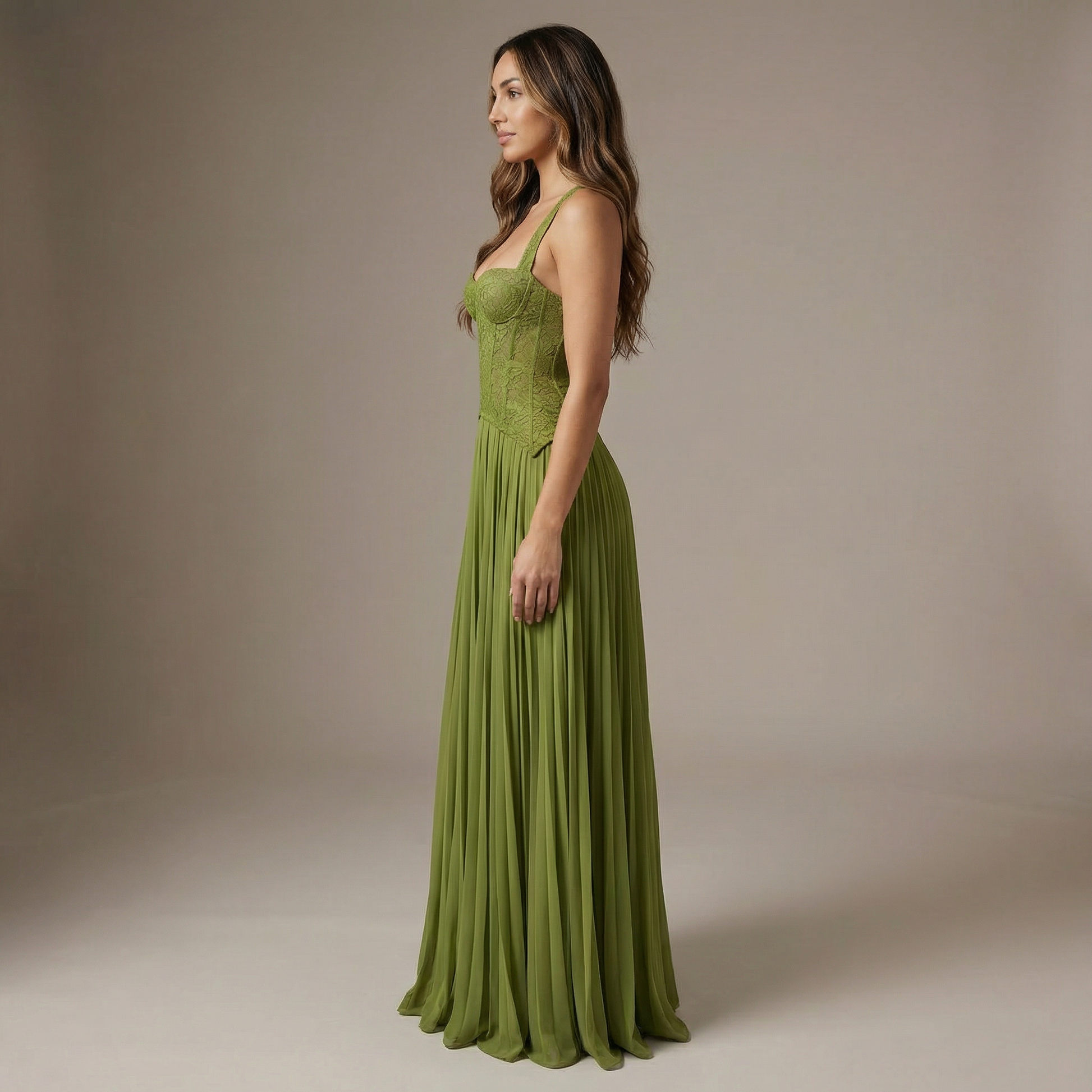 Side view of women's lime green maxi dress showing structured lace bodice and flowing pleated skirt