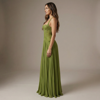 Side view of women's lime green maxi dress showing structured lace bodice and flowing pleated skirt