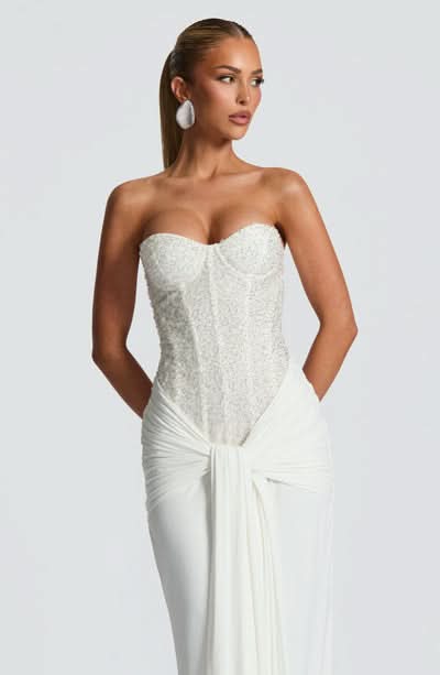 Cream sequin embellished strapless evening gown with twisted waist detail