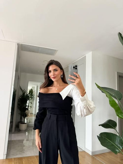 Two-tone sweater with white puffy sleeves and black off-shoulder body