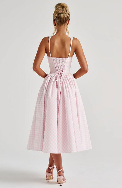 Back view of pink checkered midi dress with lace-up corset detail