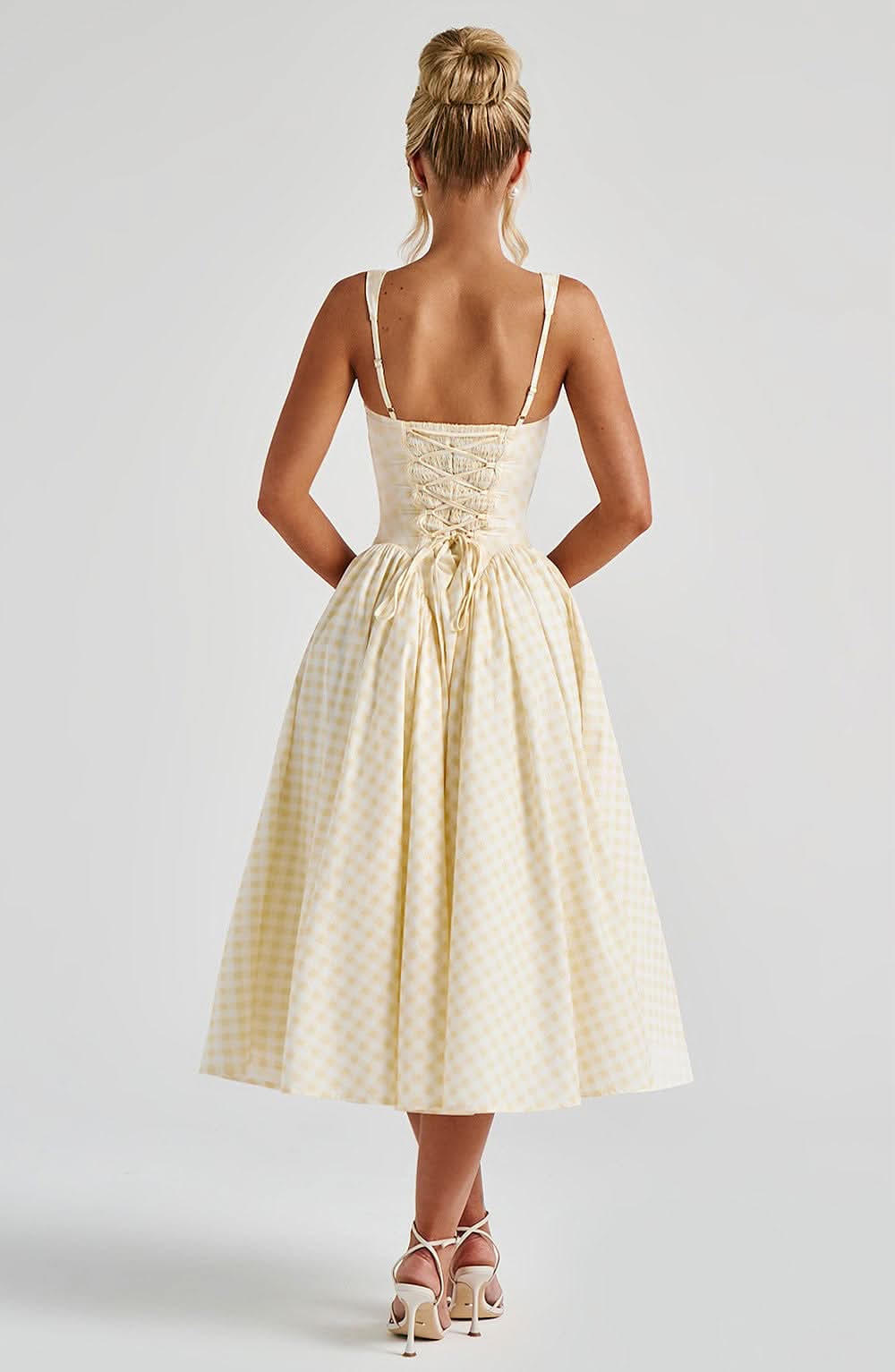 Back view of cream gingham midi dress with lace-up corset closure