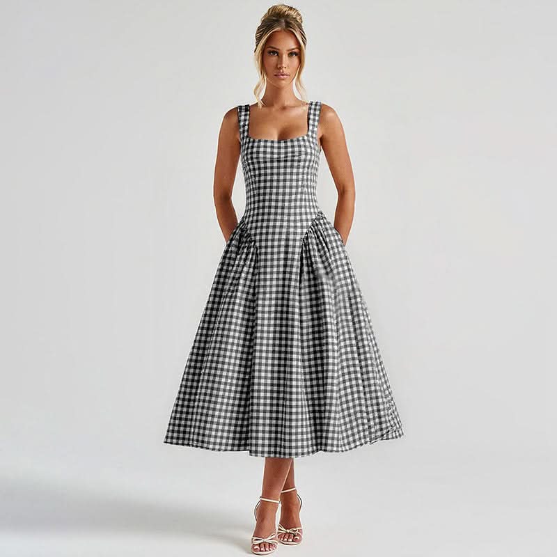 Navy and white checkered midi dress with fitted bodice and pleated skirt
