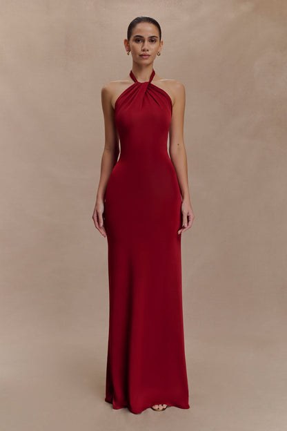 Full-length burgundy halter maxi dress with fitted silhouette