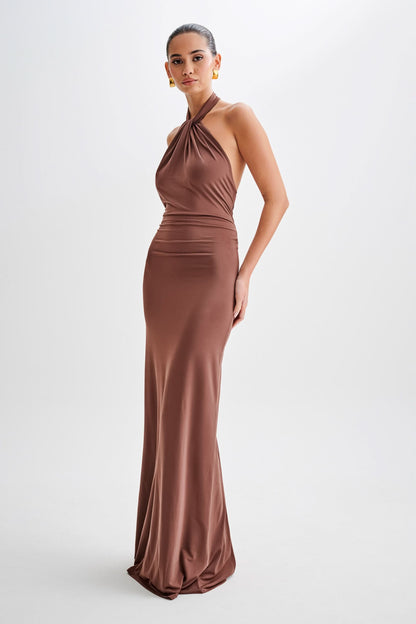 Full-length burgundy halter maxi dress with fitted silhouette