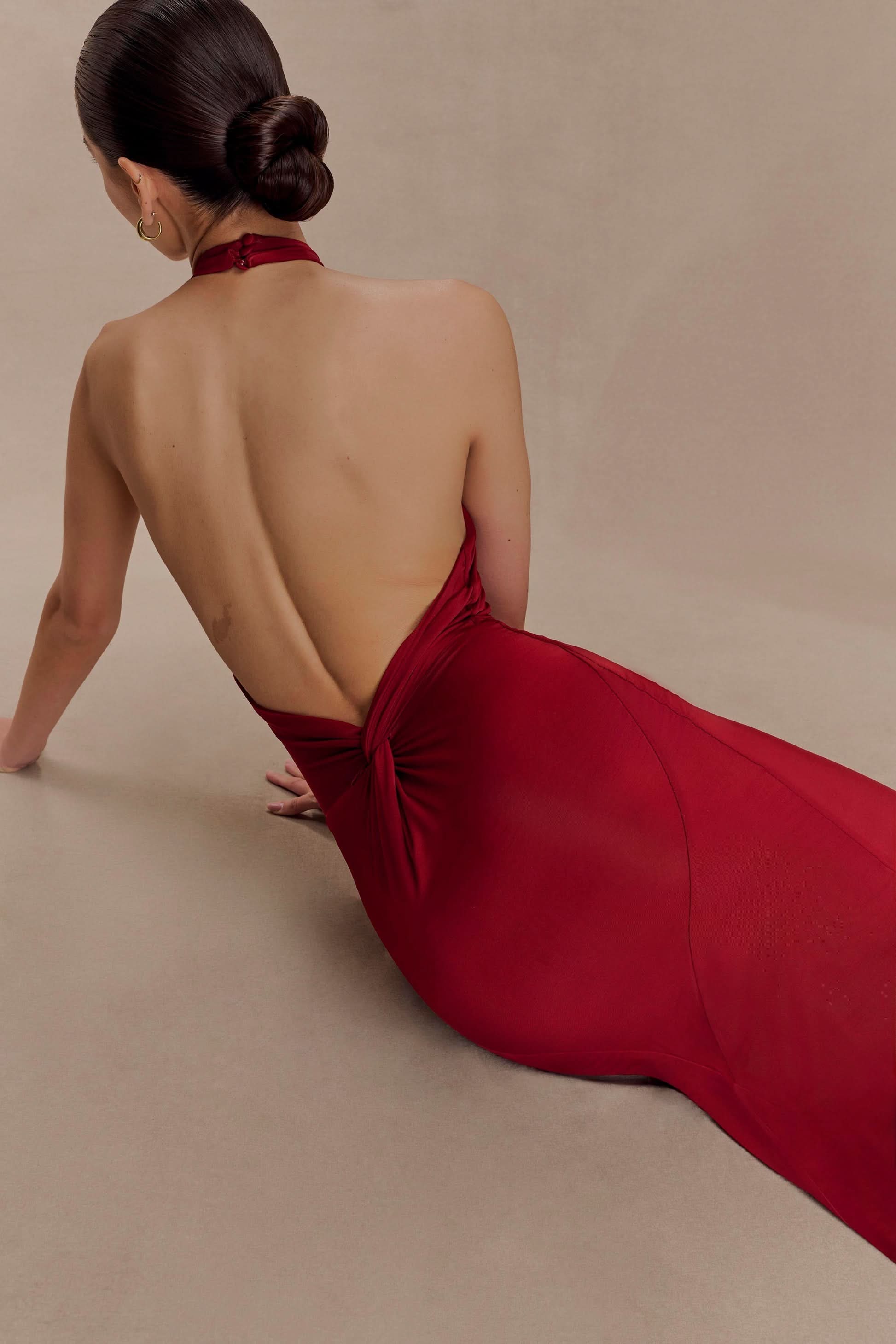 Red halter maxi dress back view showing open back design