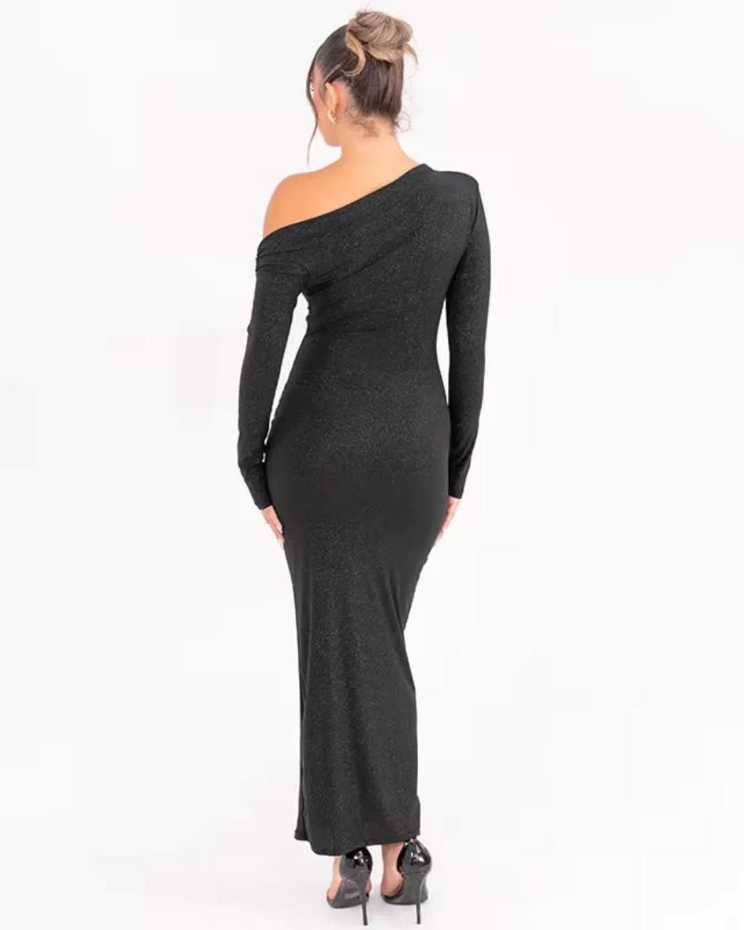 Back view of black fitted maxi dress with long sleeves and draped neckline