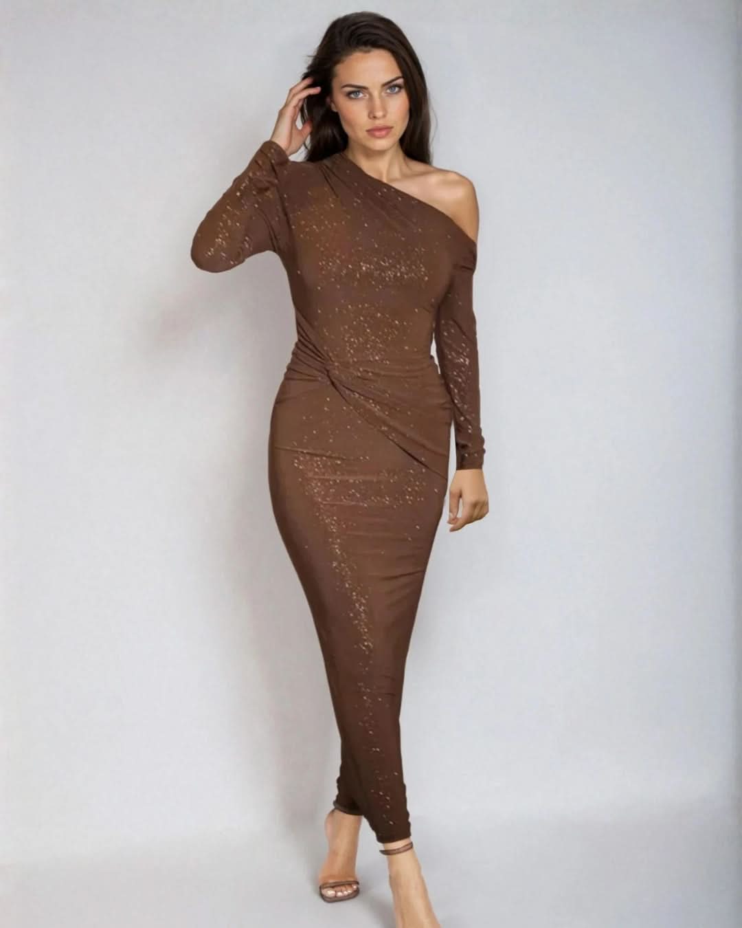 Brown sequin maxi dress with one-shoulder neckline and long fitted sleeves