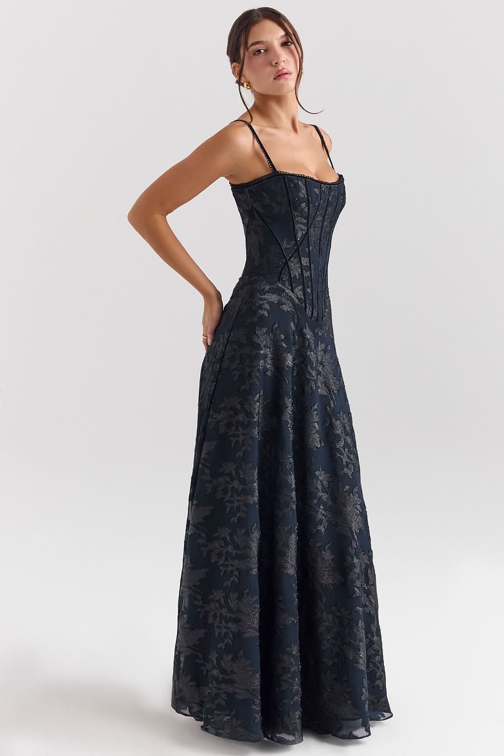 Side view of navy chiffon maxi dress showing corset bodice detail