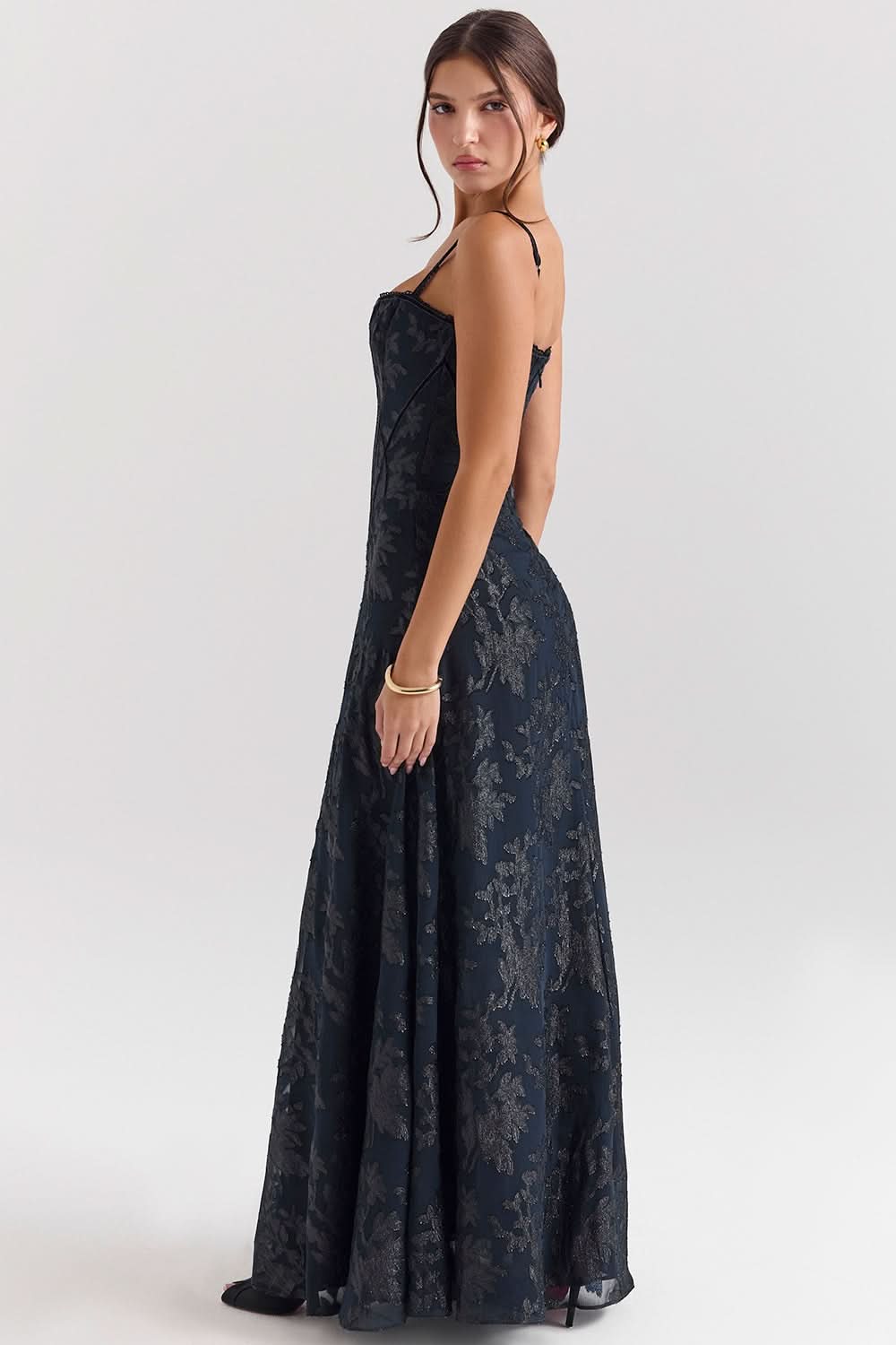 Back view of navy chiffon maxi dress with open back design