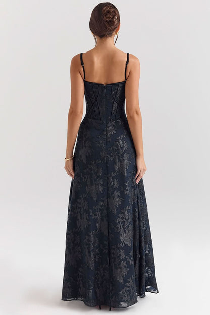 Navy chiffon maxi dress with corset bodice styled with champagne glass