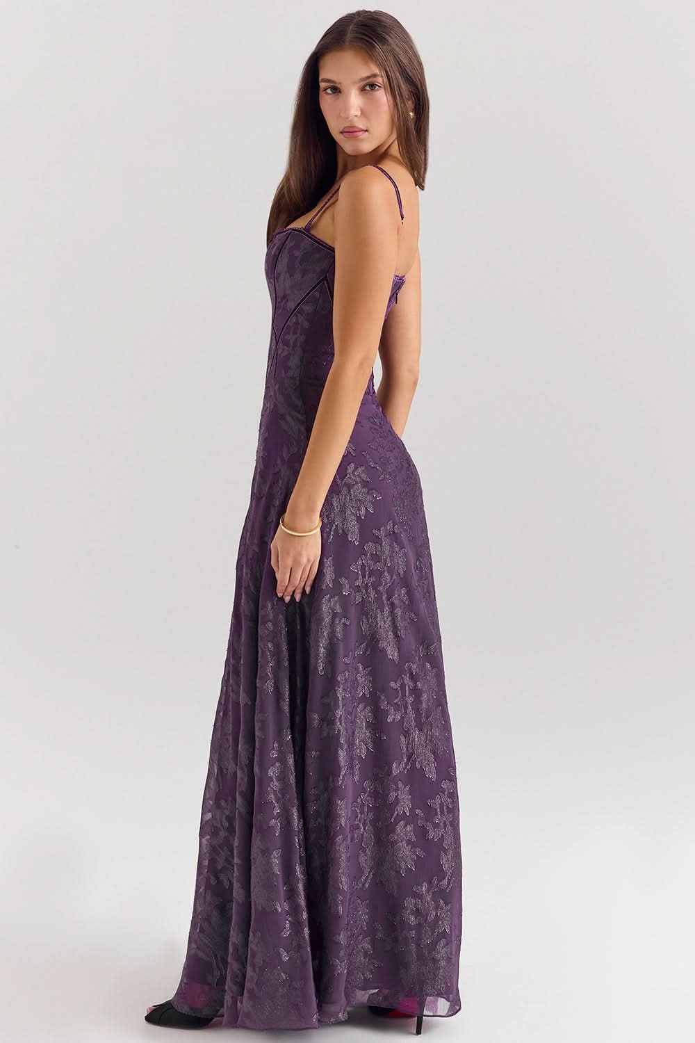 Back view of purple chiffon dress showing open back design
