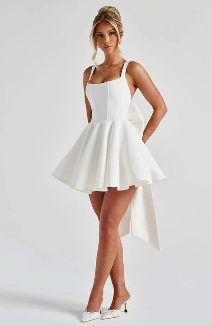 Cream fit-and-flare mini dress with tank straps and high-low hemline