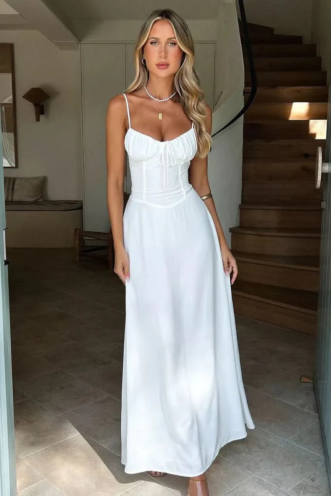 White spaghetti strap maxi dress with ruched corset bodice and full length skirt