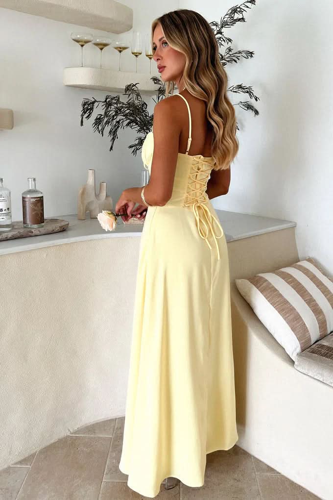 Back view of yellow maxi dress with lace-up corset back