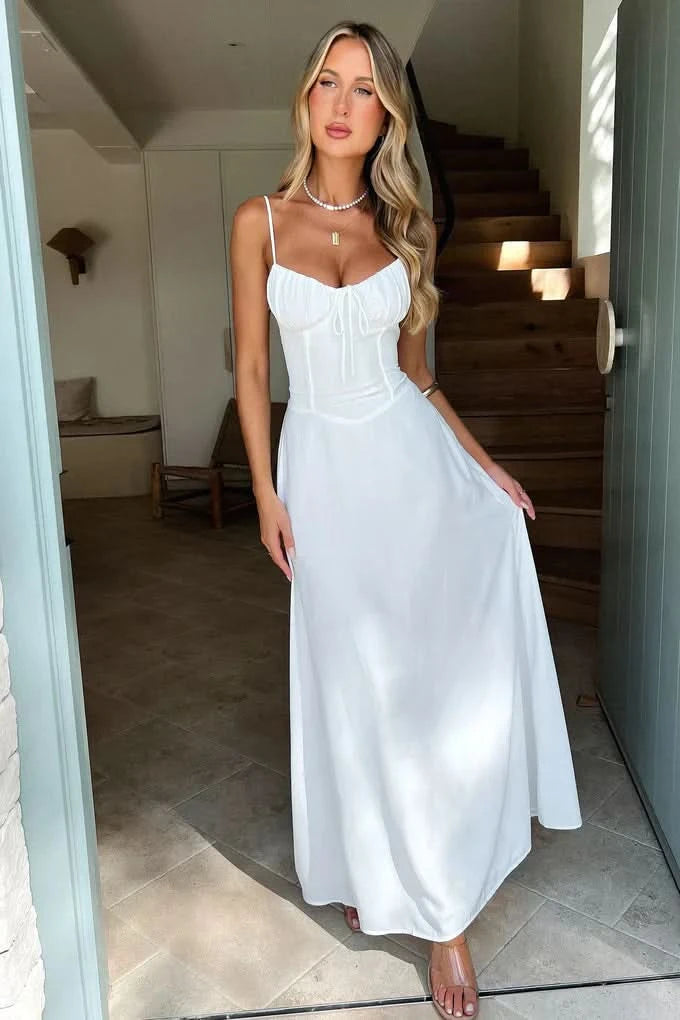 White maxi dress with corset bodice and spaghetti straps