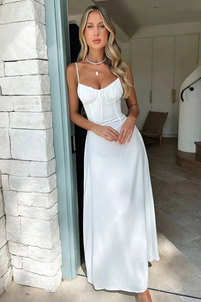 Back view of white maxi dress with lace-up corset detail