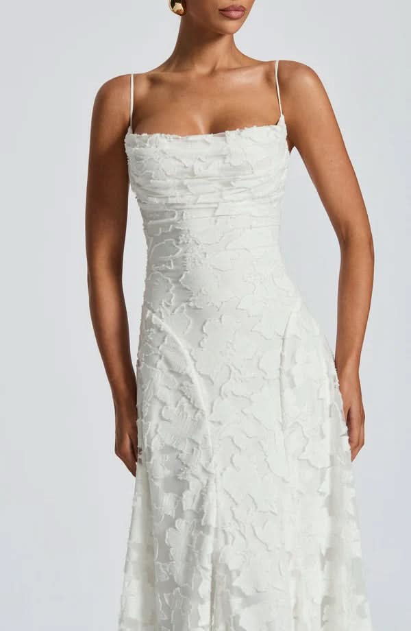 White textured maxi dress with square neckline and fitted bodice, close-up front