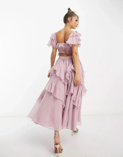 Back view of pink ruffle midi dress with open back and cascading ruffles