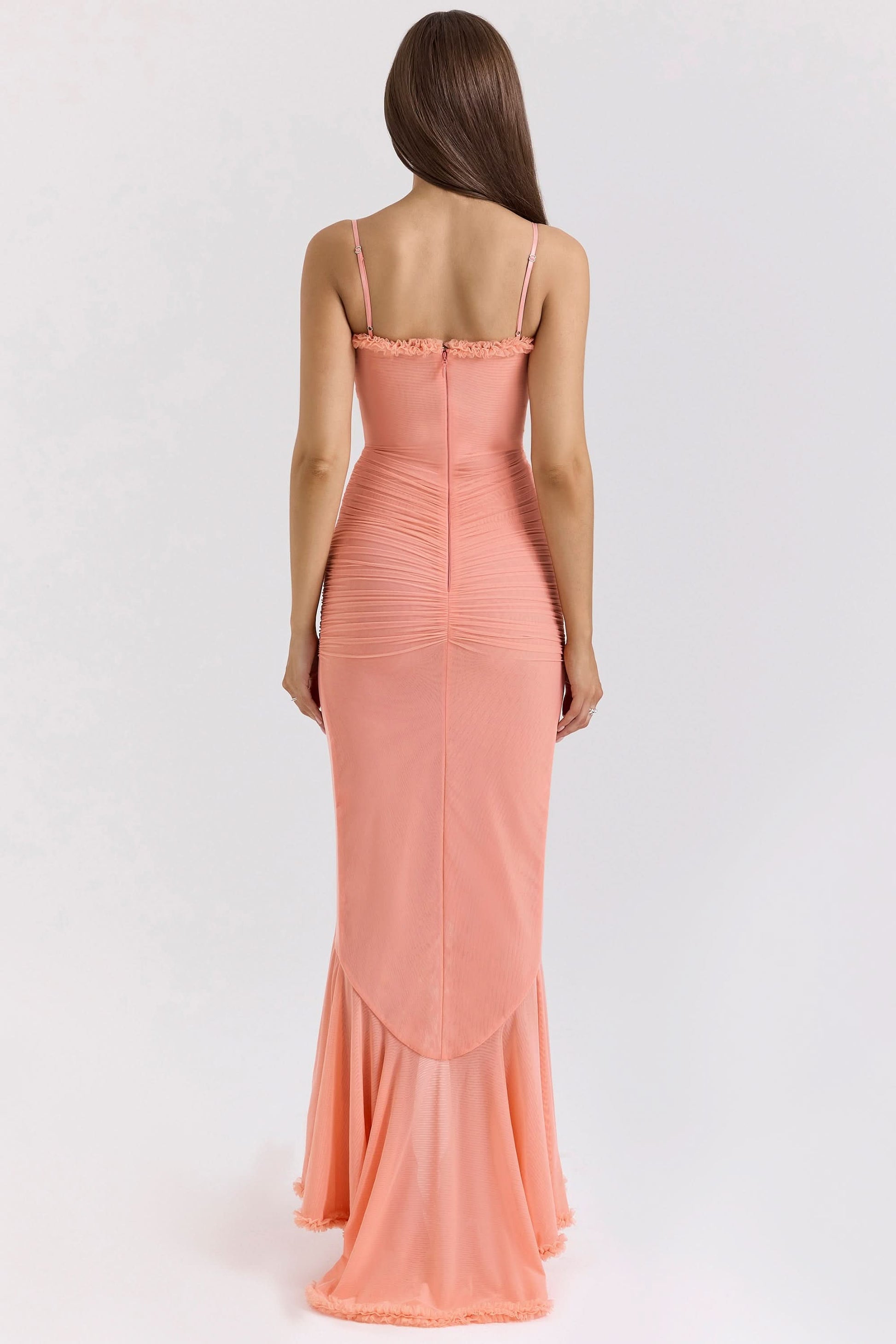 Back view of coral ruffled maxi dress with spaghetti straps
