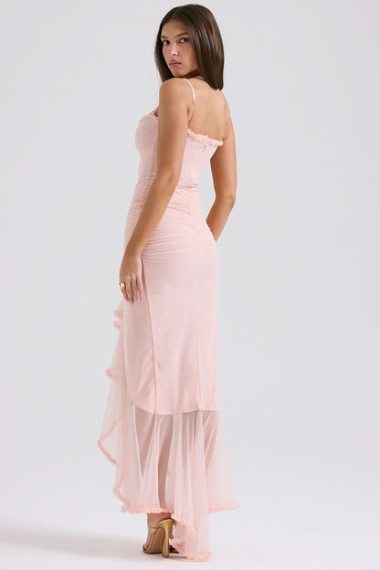 Back view of blush pink maxi dress showing open back and ruched fabric detail