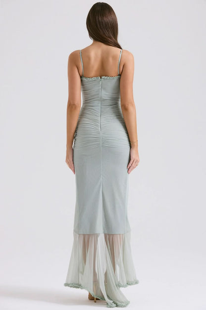 Back view of sage green maxi dress showing open back and ruched bodice detail