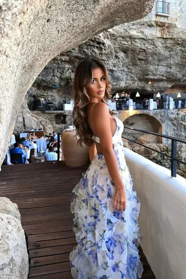 Back view of white ruffle maxi dress showing open back and tiered layers for women