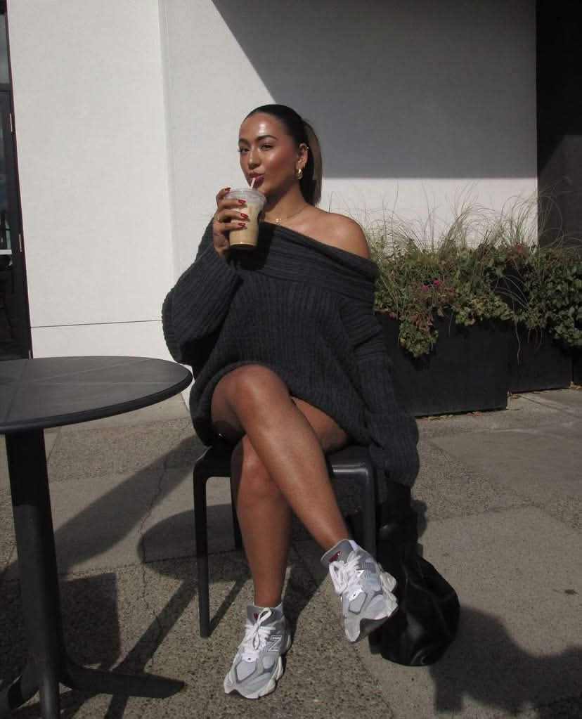 Black ribbed sweater with wide cowl neckline and voluminous long sleeves