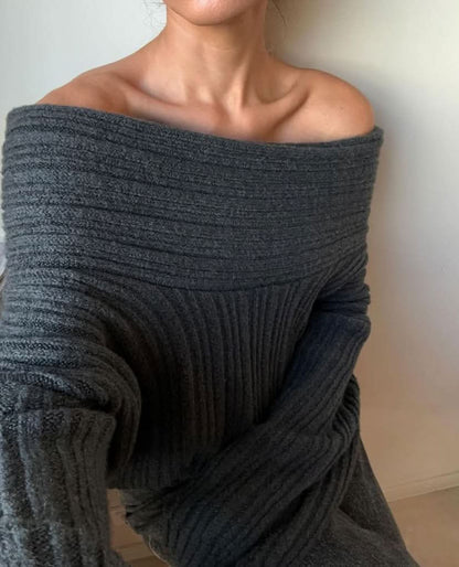 Close-up of gray ribbed sweater fabric showing texture and off-shoulder drape