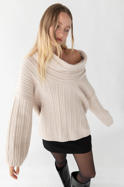 Cream ribbed off-shoulder sweater with draped cowl neckline and long sleeves