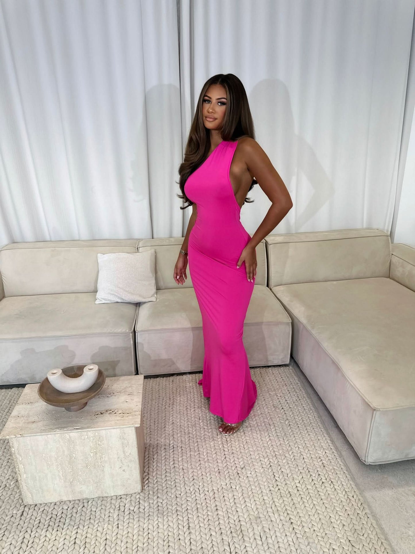 pink sleeveless maxi dress with fitted bodice and drape