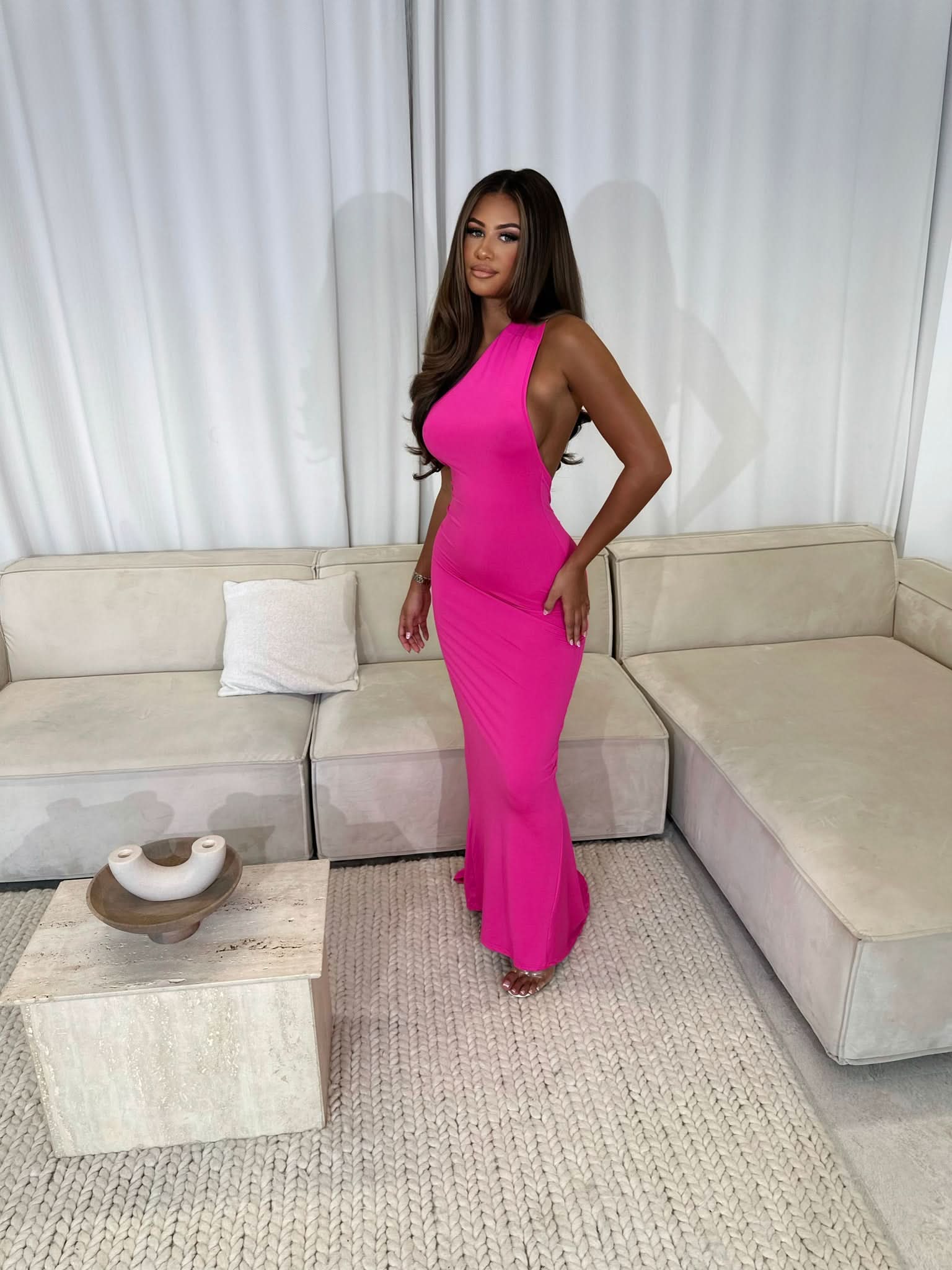 pink sleeveless maxi dress with fitted bodice and drape