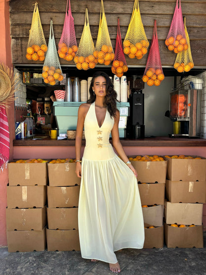 Cream halter maxi dress with gold starfish details and flowing skirt