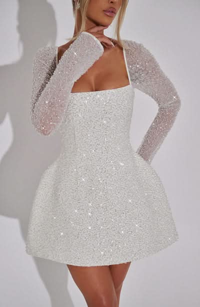 White sequin fit-and-flare mini dress with sheer beaded long sleeves