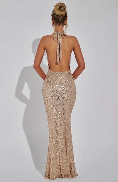 Back view of champagne sequin maxi dress with tie-back halter closure
