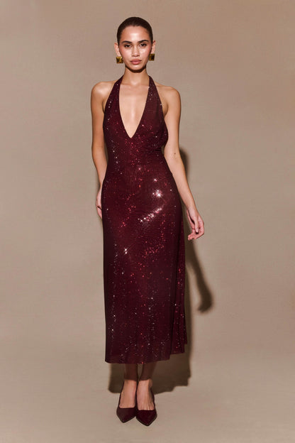 Burgundy sequin halter maxi dress with deep V-neckline and fitted silhouette