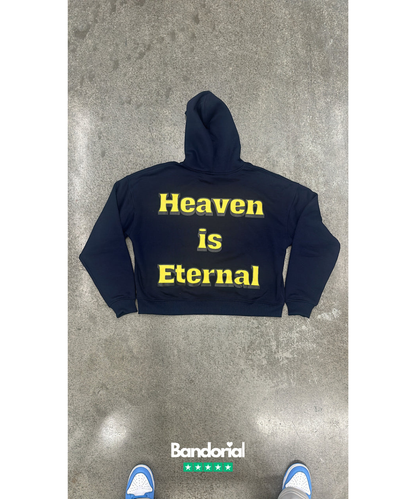 Back view of navy hoodie with yellow Heaven is Eternal text