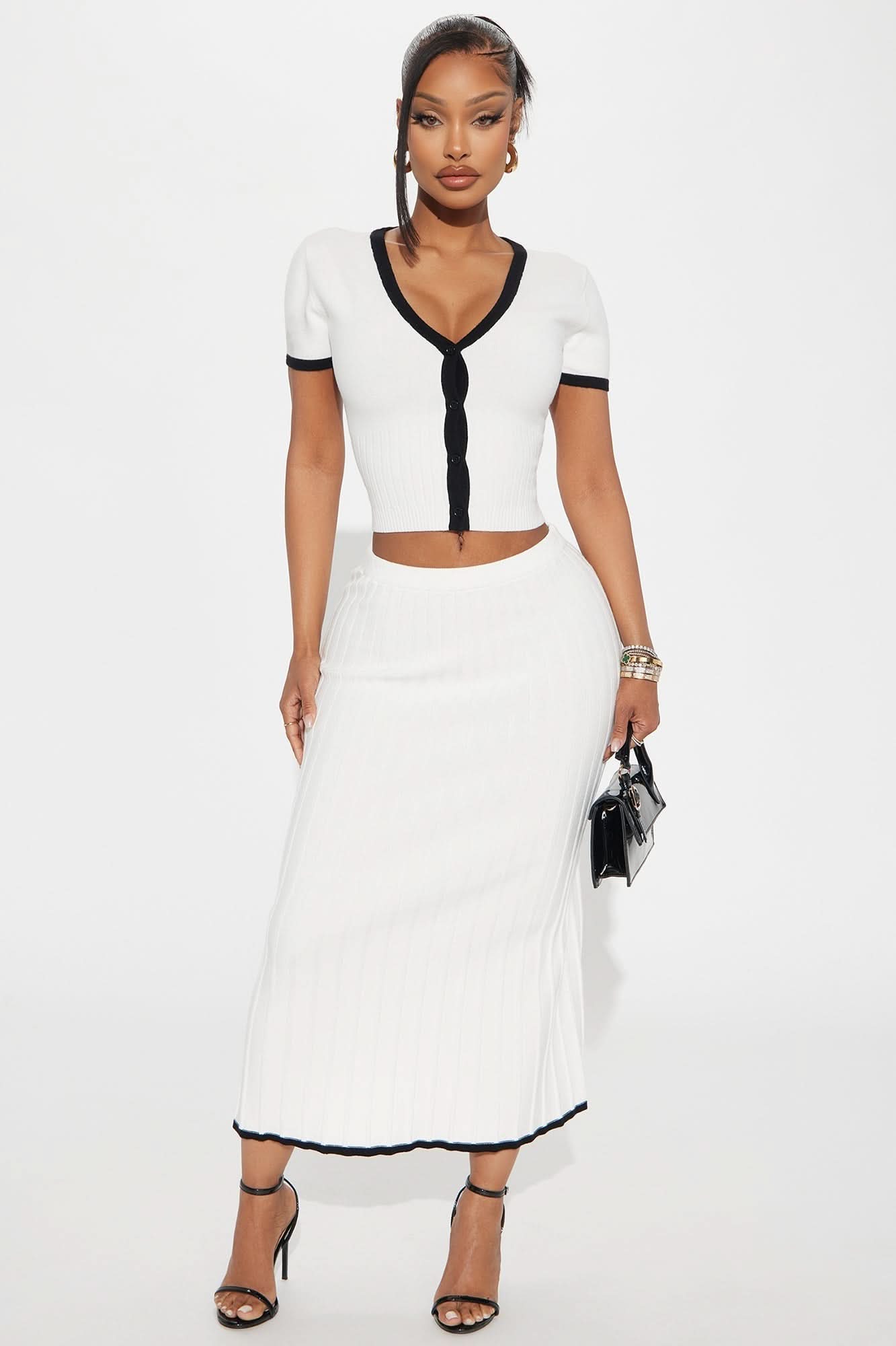 White ribbed two-piece set with black trim, button-front crop top and midi skirt