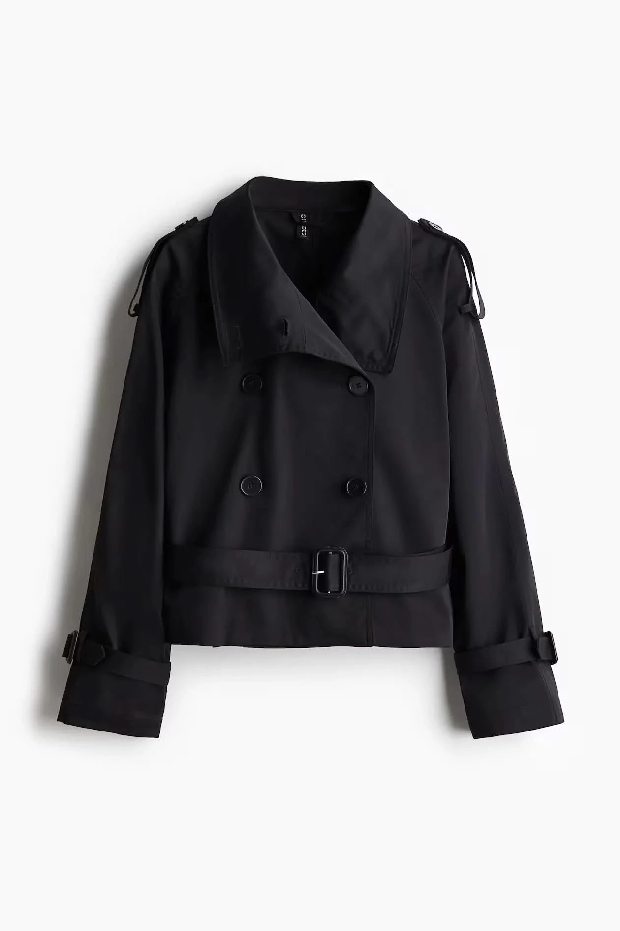 Black short trench coat flat lay with button details and belt buckle