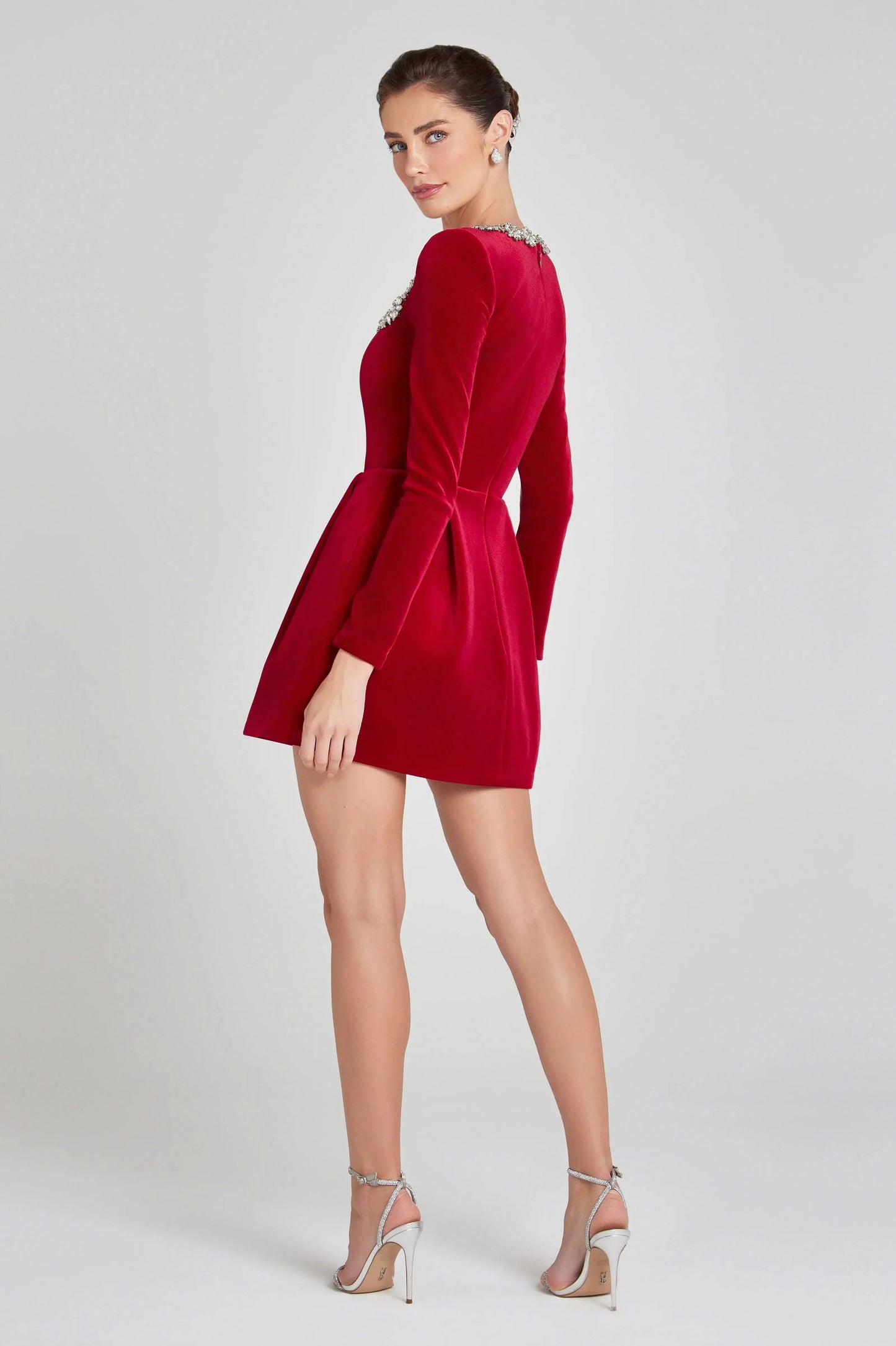 Back view of red velvet mini dress with crystal-trimmed neckline