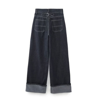 Back view of dark denim wide-leg pants with gray cuffed hem and back pockets