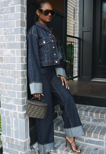 Dark denim jacket and matching jeans with light blue cuff details and contrast stitching