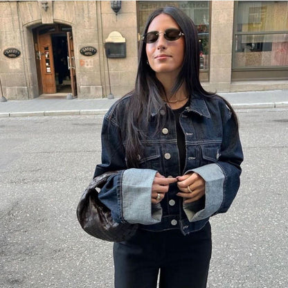Dark denim jacket with rolled light blue cuffs and matching dark jeans with cuffed legs