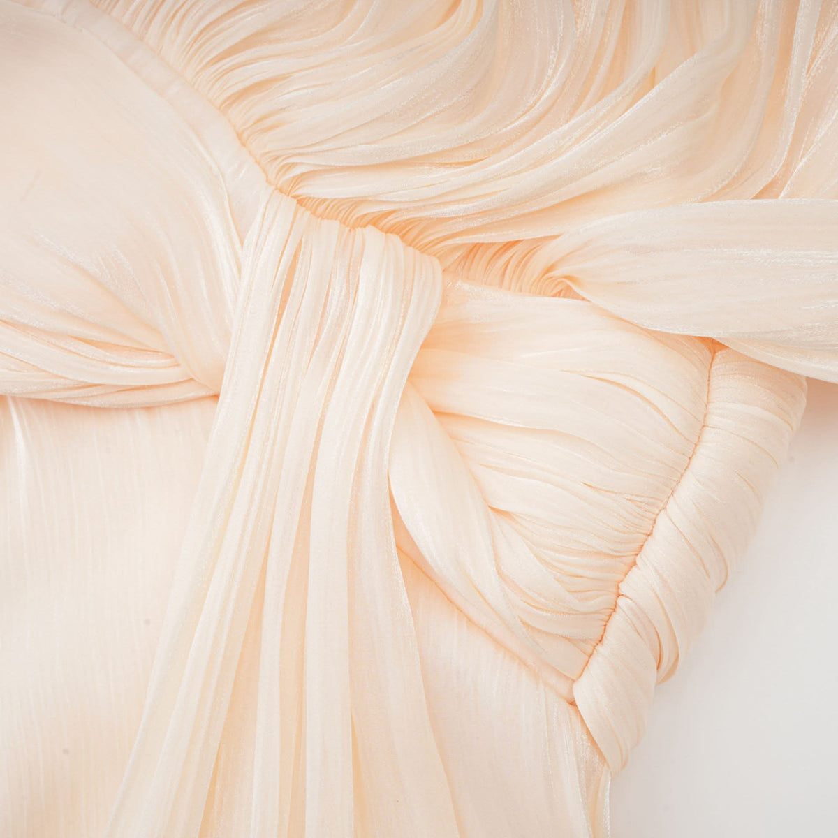 Cream pleated cape sleeve with layered ruffle edge detail