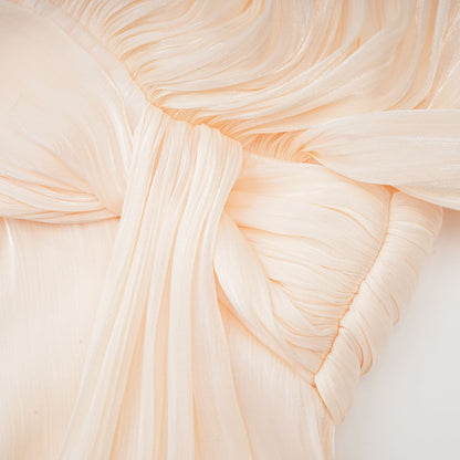 Cream pleated cape sleeve with layered ruffle edge detail