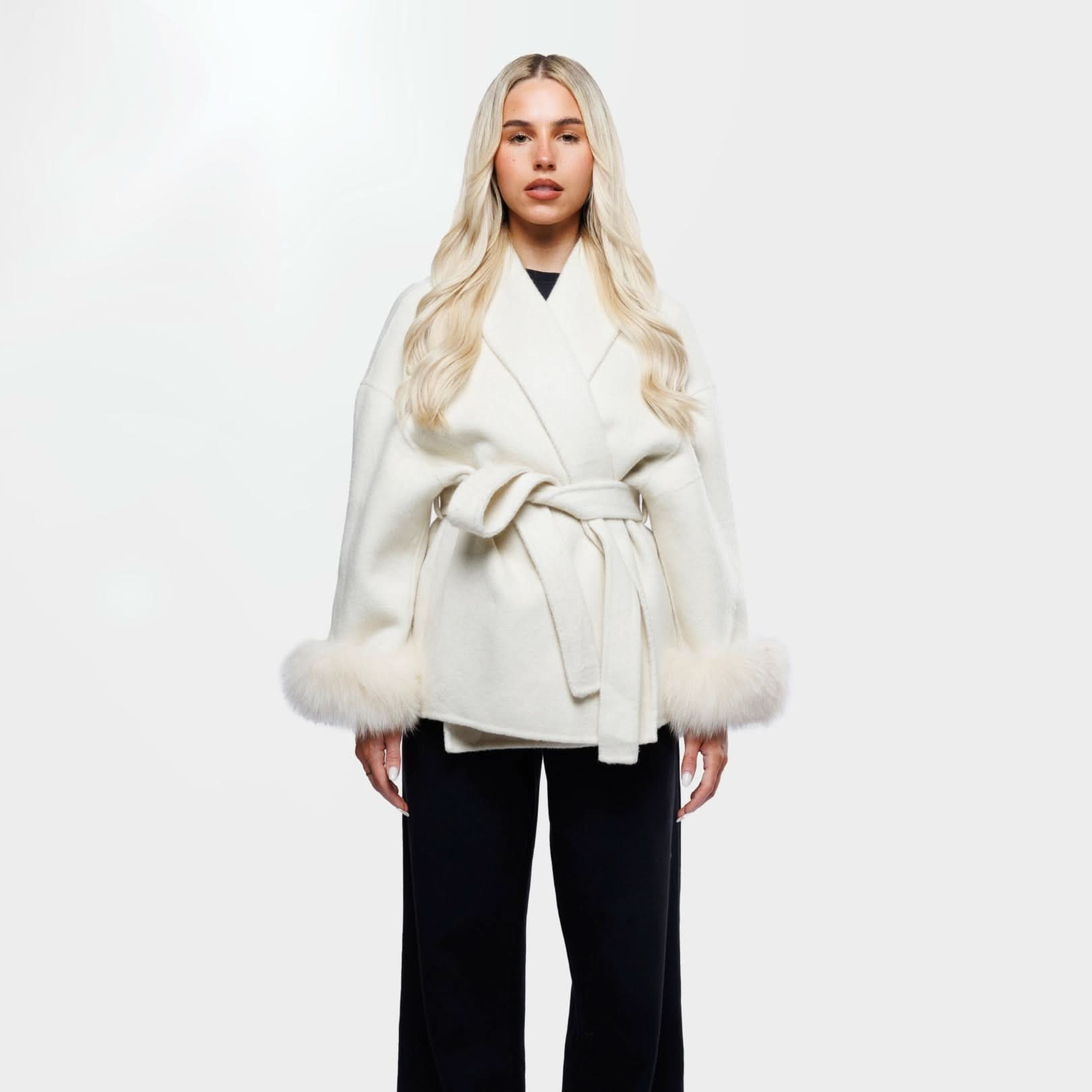Ivory luxury coat with fur-trimmed cuffs and tie waist, front view