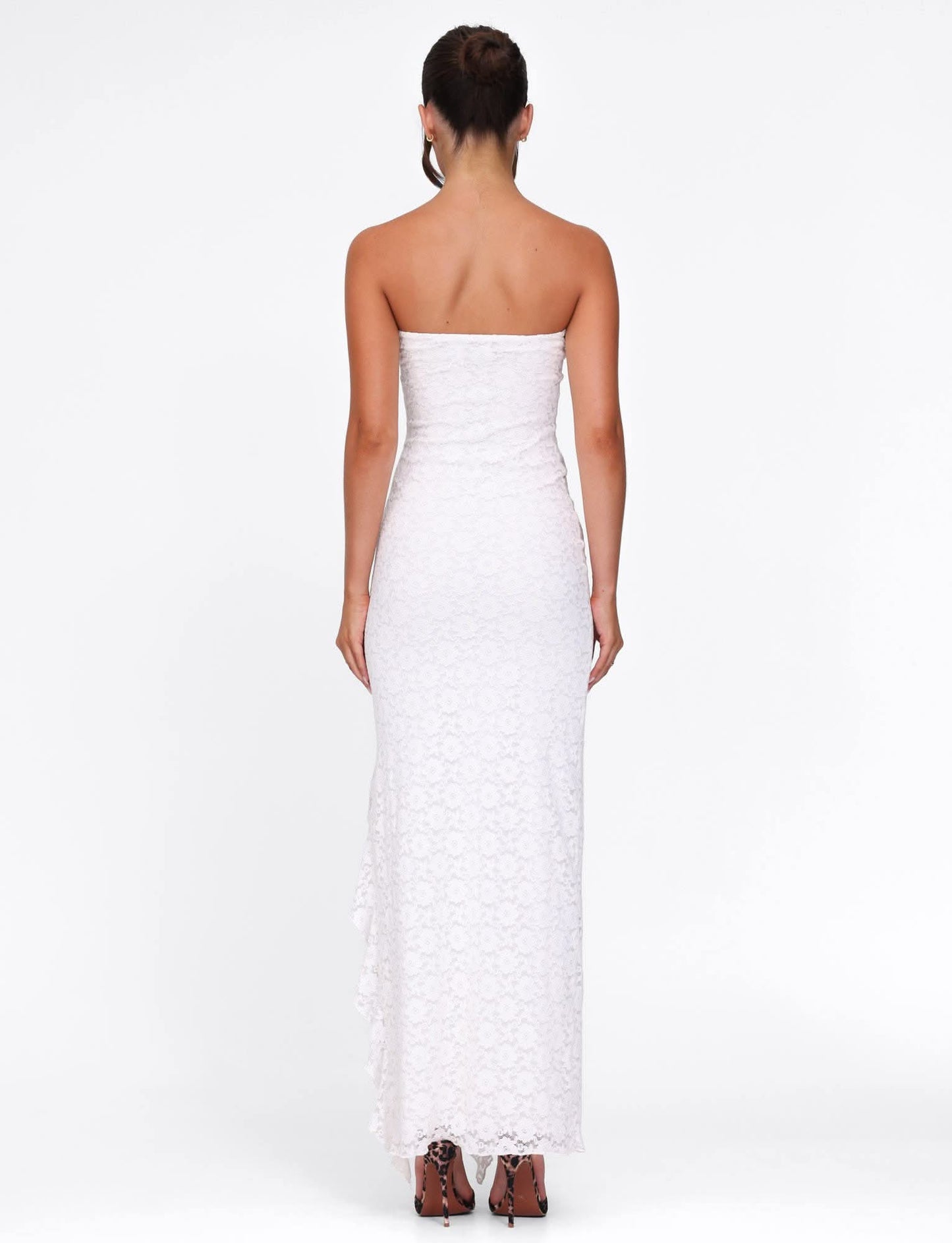 Back view of white lace maxi dress with strapless cut and long train