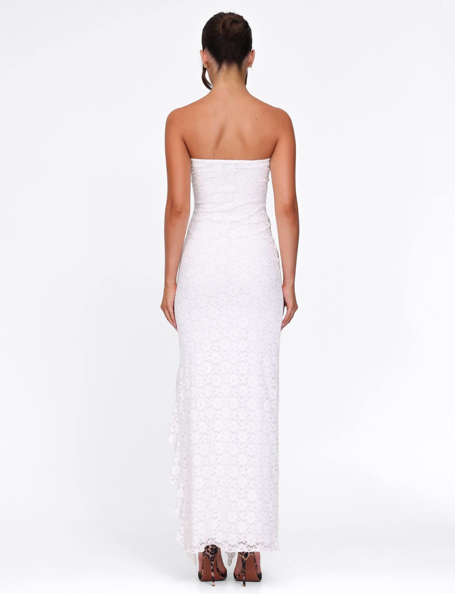 Back view of white lace maxi dress with strapless cut and long train